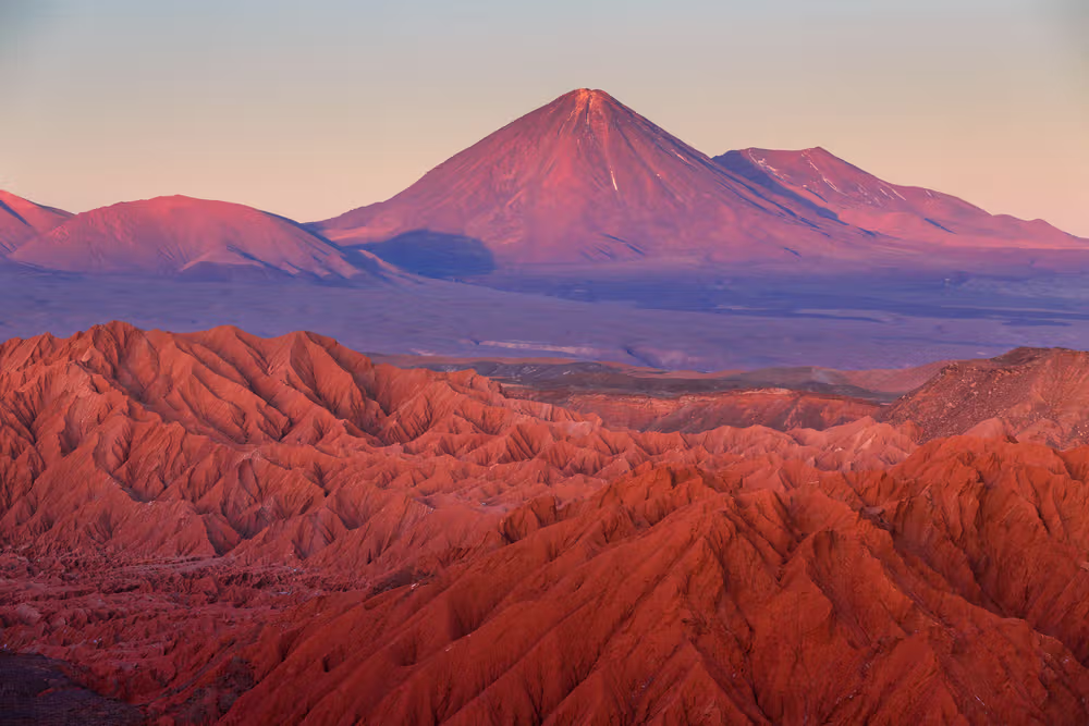 Sunset light over the Atacama desert and volcanic peaks in northern Chile