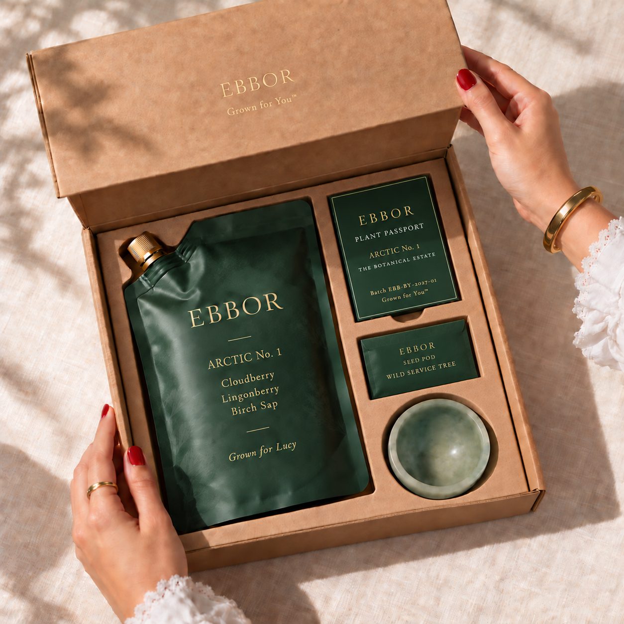An opened Ebbor pack: the edition, its Plant Passport and the stone sipping bowl in a light outer box