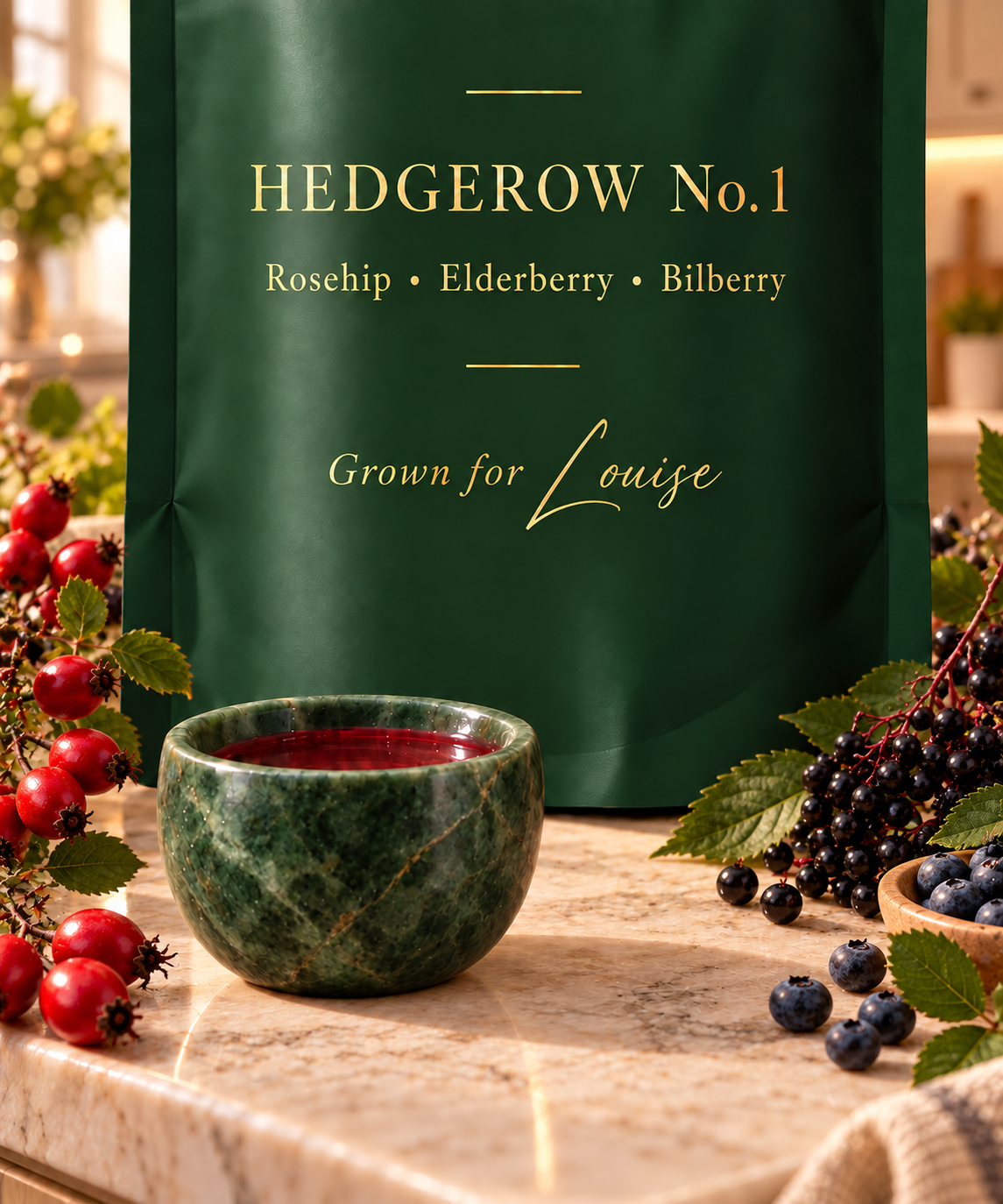 The Hedgerow No.1 plant pouch beside the stone sipping bowl, with rosehips, elderberries and bilberries